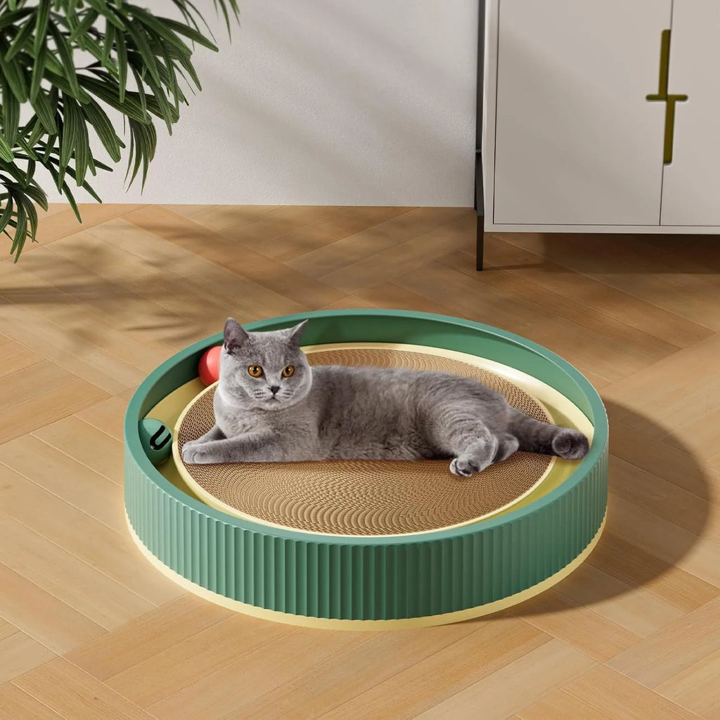 Large green circular cardboard cat scratching board with three built-in ball toys on a white base.