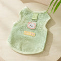 Cat wearing green bear patch cartoon clothing with hollowed-out breathable design