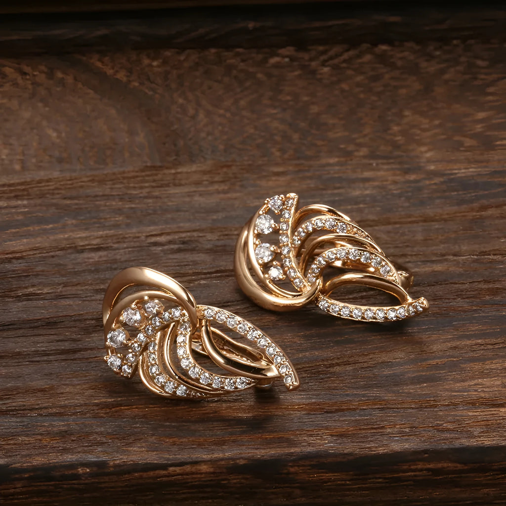 Gold geometric wing ear clips with micro-inlaid zircon stones on U-shaped copper clips