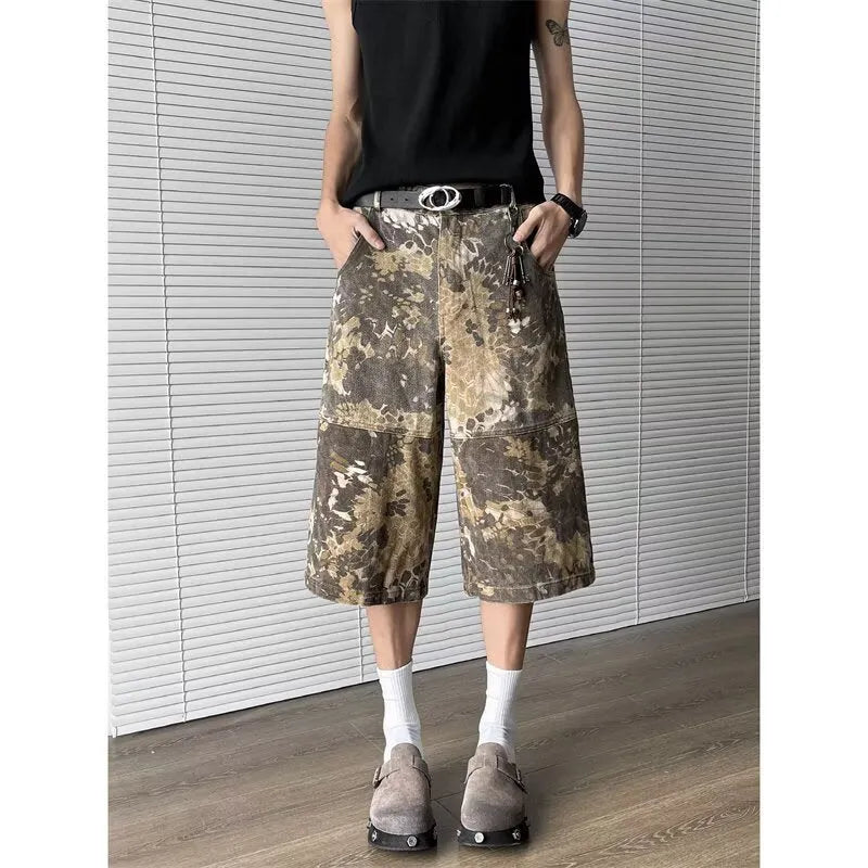 Yellow snake pattern camouflage cropped jeans on hanger showing cotton denim fabric