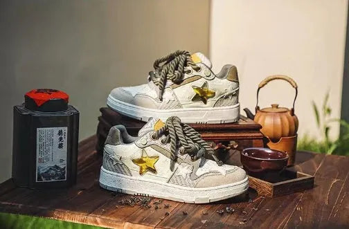 Green low-top casual shoes with star pattern stitching and thick rubber sole.