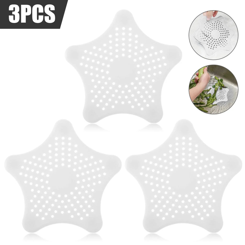 Three silicone starfish-shaped sink drain filters in white blue and green with suction cups