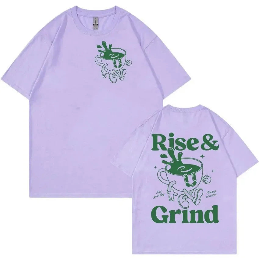 Man wearing a loose black linen t-shirt with a green 'Rise And Grind Green Coffee' cartoon graphic print.