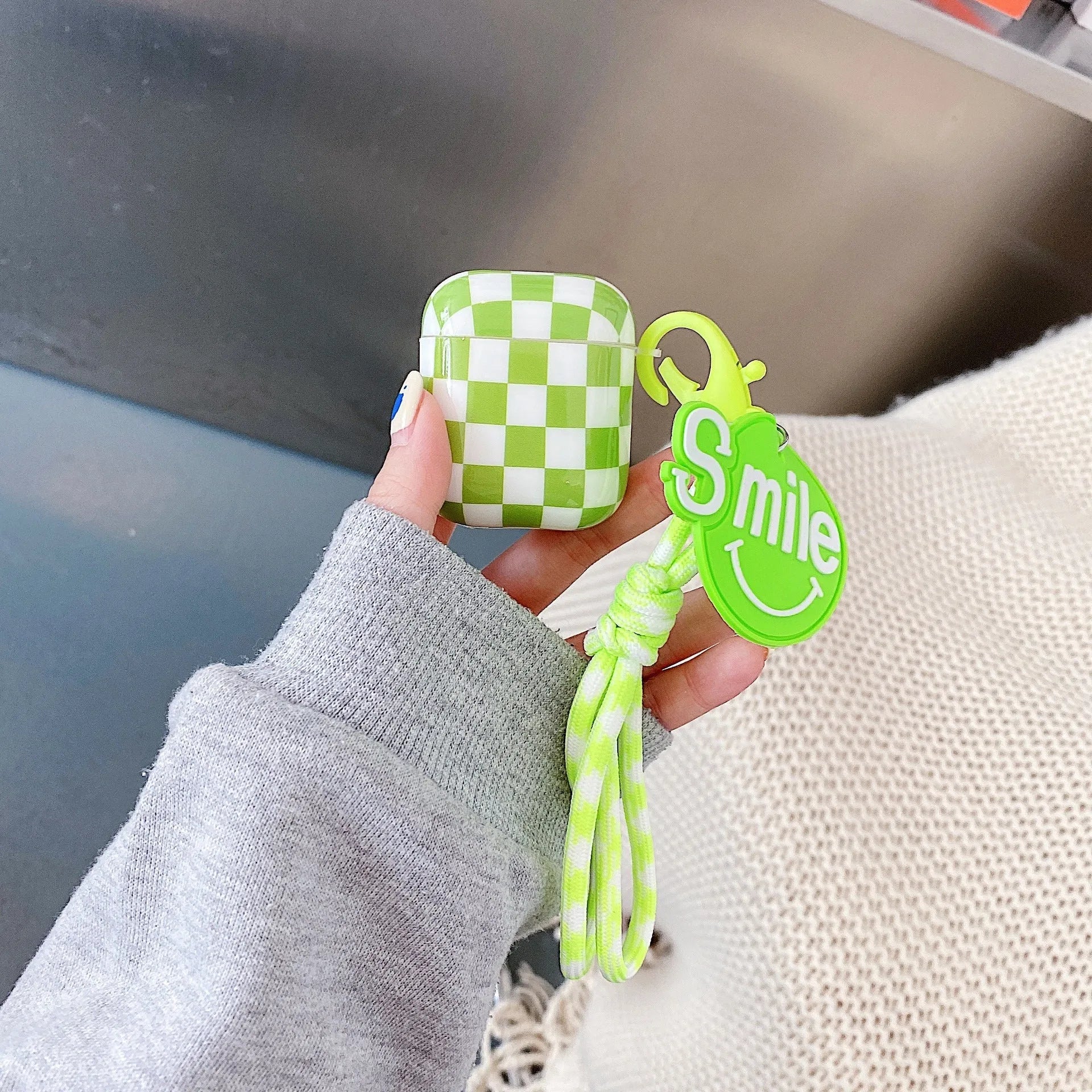 Black and green checkerboard pattern TPU case for Apple AirPods with optional pendant attachments
