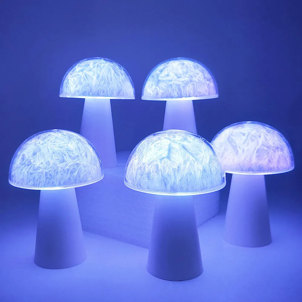 White mushroom-shaped night light with remote control on a wooden surface, showing soft RGB glow.
