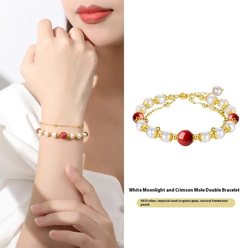 Sterling silver double-layer bracelet with white freshwater pearls and cinnabar red beans
