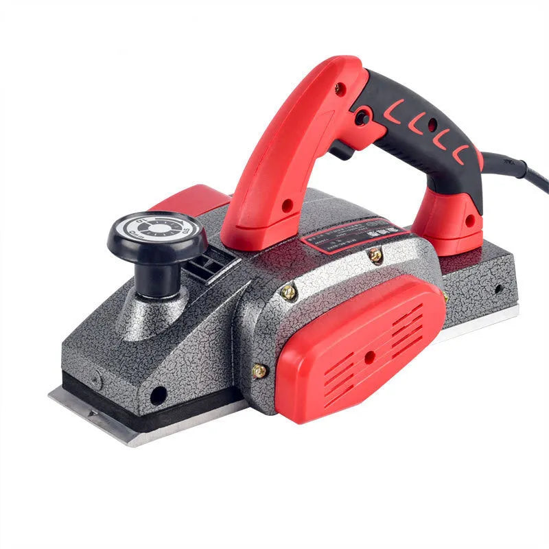 Red aluminium electric wood planer with 82mm width on workbench