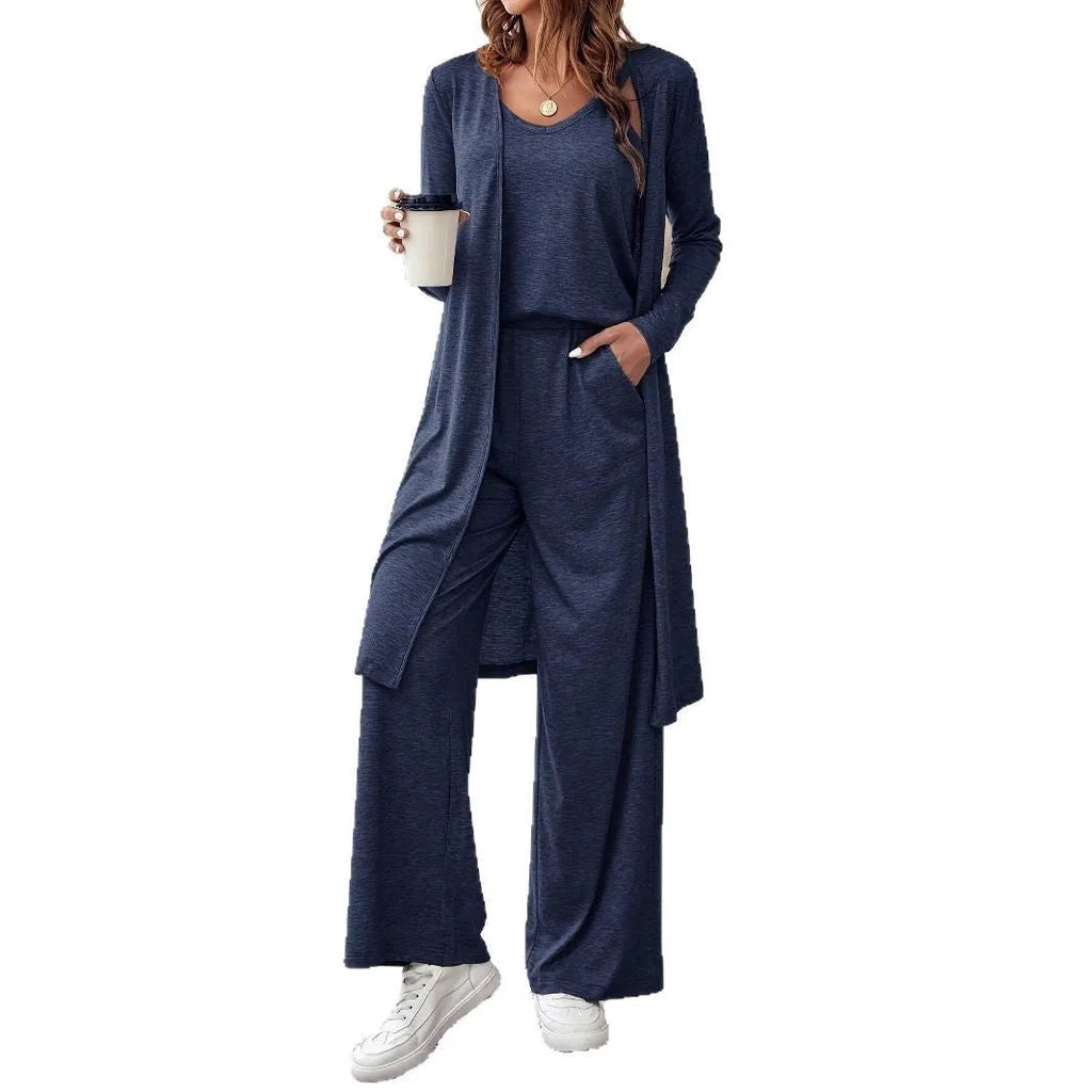 Blue women's three-piece casual suit with sling top, long cardigan, and trousers on a hanger.