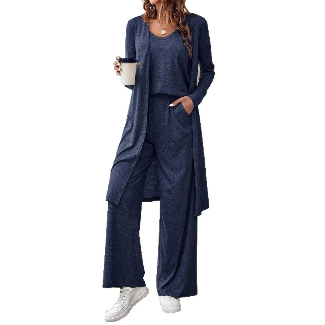 Blue women's three-piece casual suit with sling top, long cardigan, and trousers on a hanger.