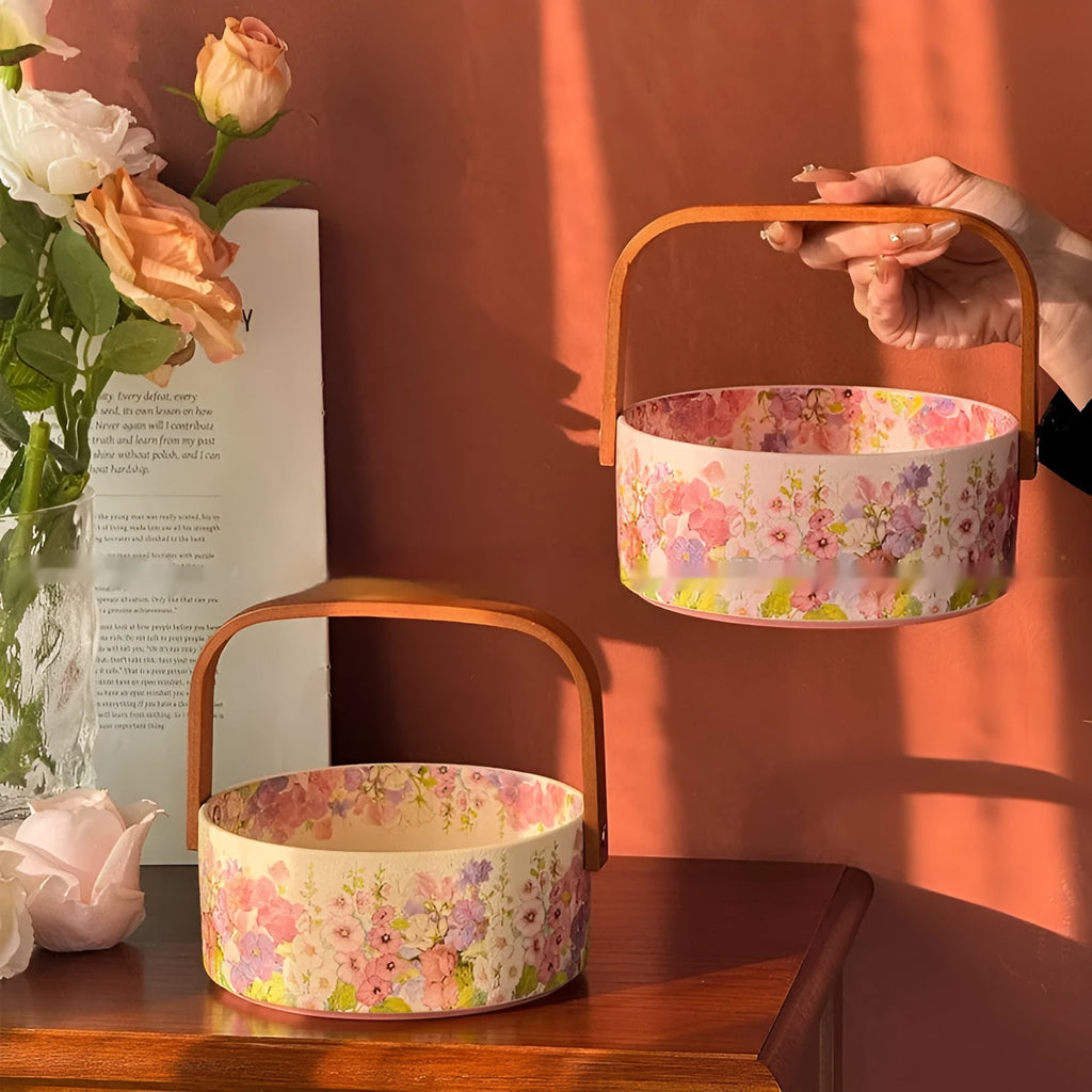 Pink ceramic fruit basket with floral pattern, 6 inches, on tea table with fruit