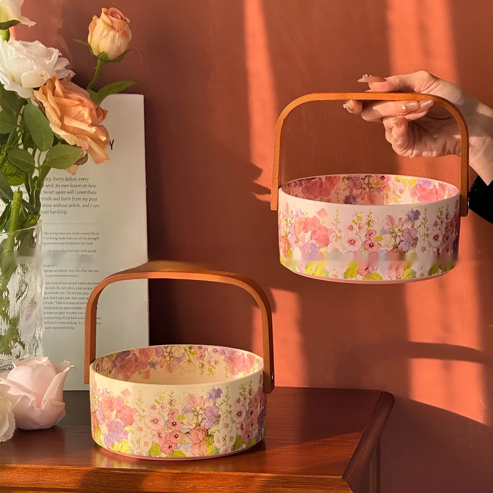 Pink ceramic fruit basket with floral pattern, 6 inches, on tea table with fruit