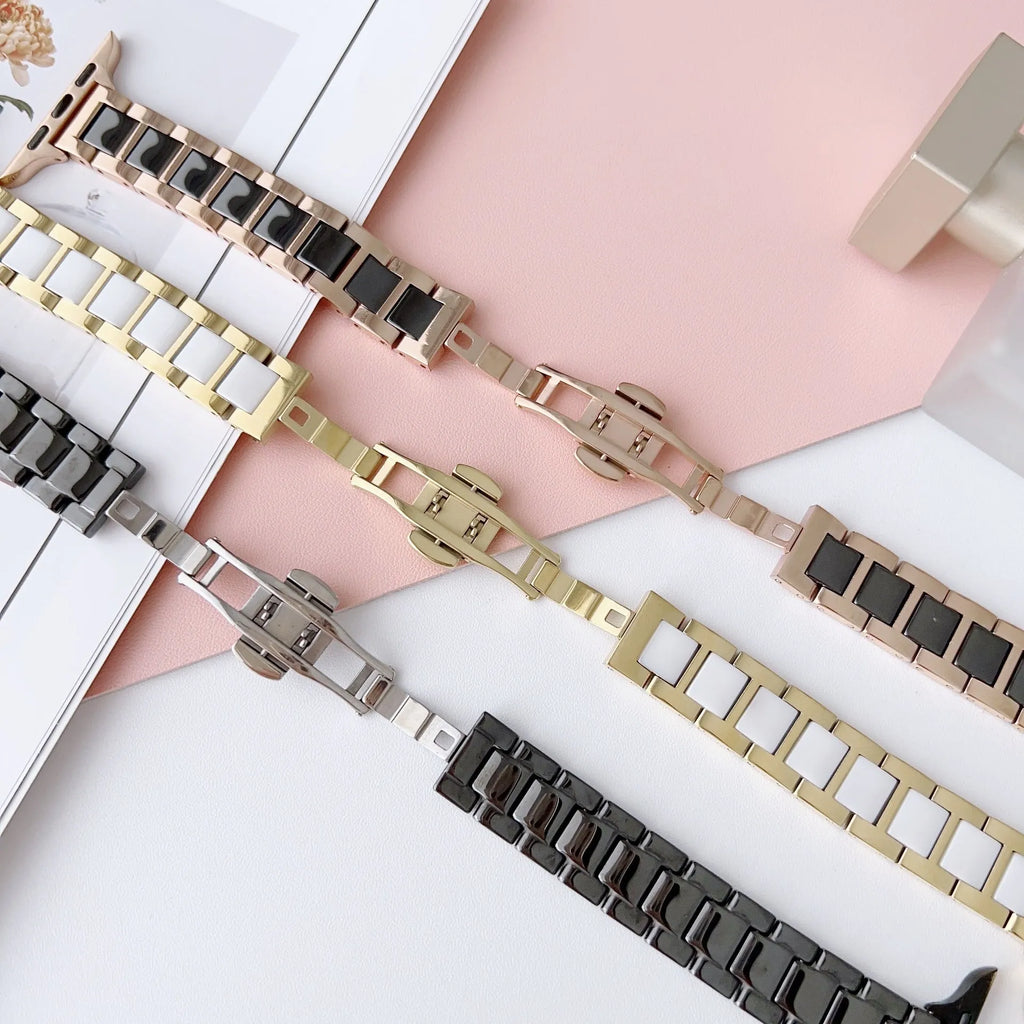 Stainless steel ceramic watch band for Apple Watch 38-49mm in gold with black ceramic finish on a wrist