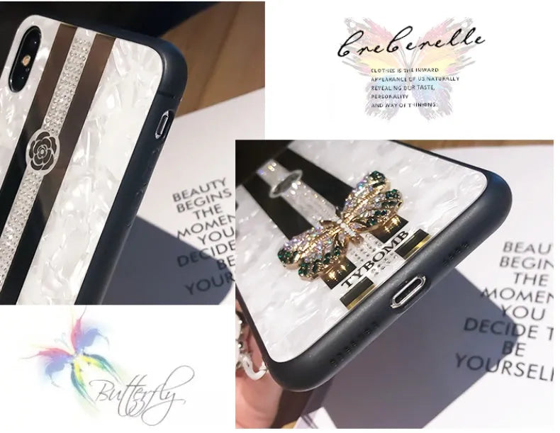 Luxury acrylic iPhone case with butterfly and diamond crystal design and a mirrored back in purple colour.