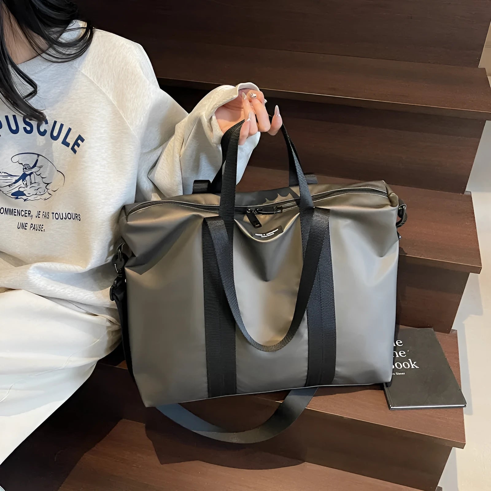 Lightweight oxford cloth tote bag in black, grey, or champagne for business travel.