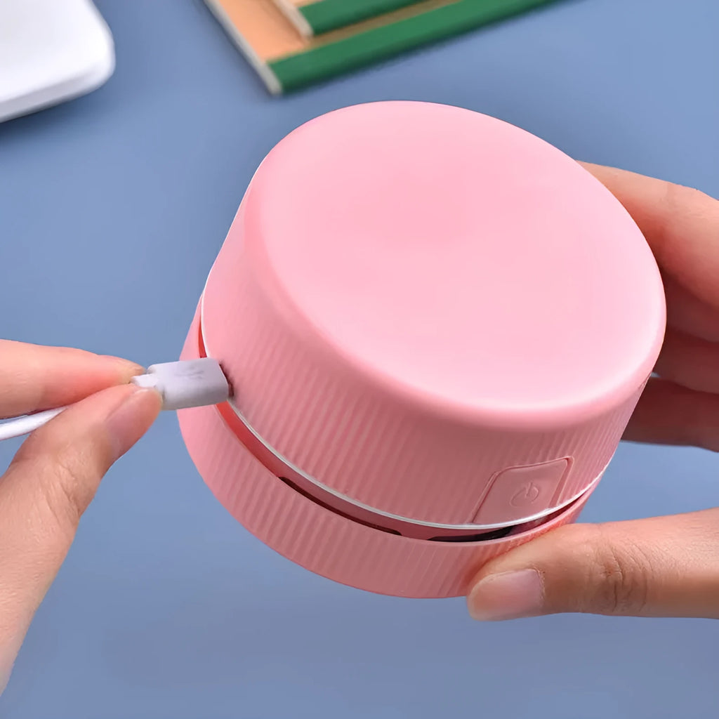 Blue mini desktop vacuum cleaner for pencil eraser chips and keyboard crumbs