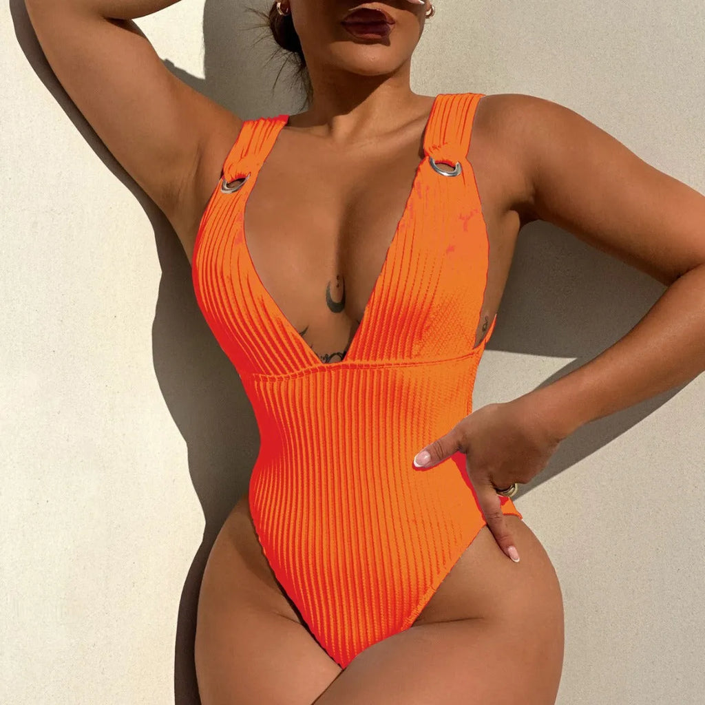 Solid colour one-piece swimsuit for women in black, displayed on a mannequin.