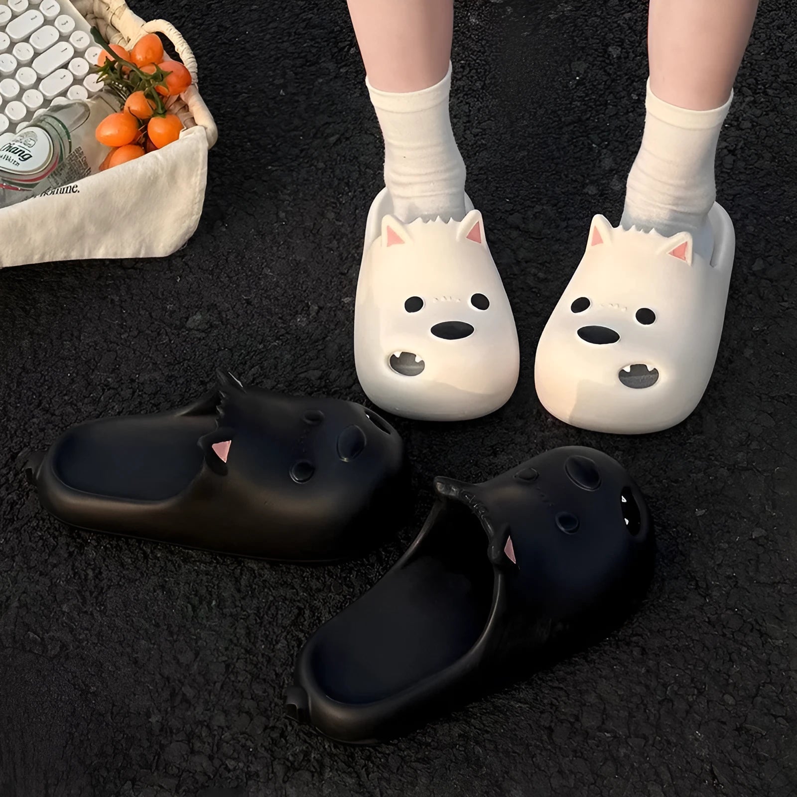 Women's black EVA toe-cap slipper sandals on a white background, showing moulded sole and open-back design.