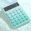 Desktop calculator with gradient colour finish in violet, pink, blue, or mint green on a desk