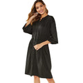 A black polyester cardigan dress with long sleeves, an elastic waist, and a removable cinch belt on a midi A-line skirt.