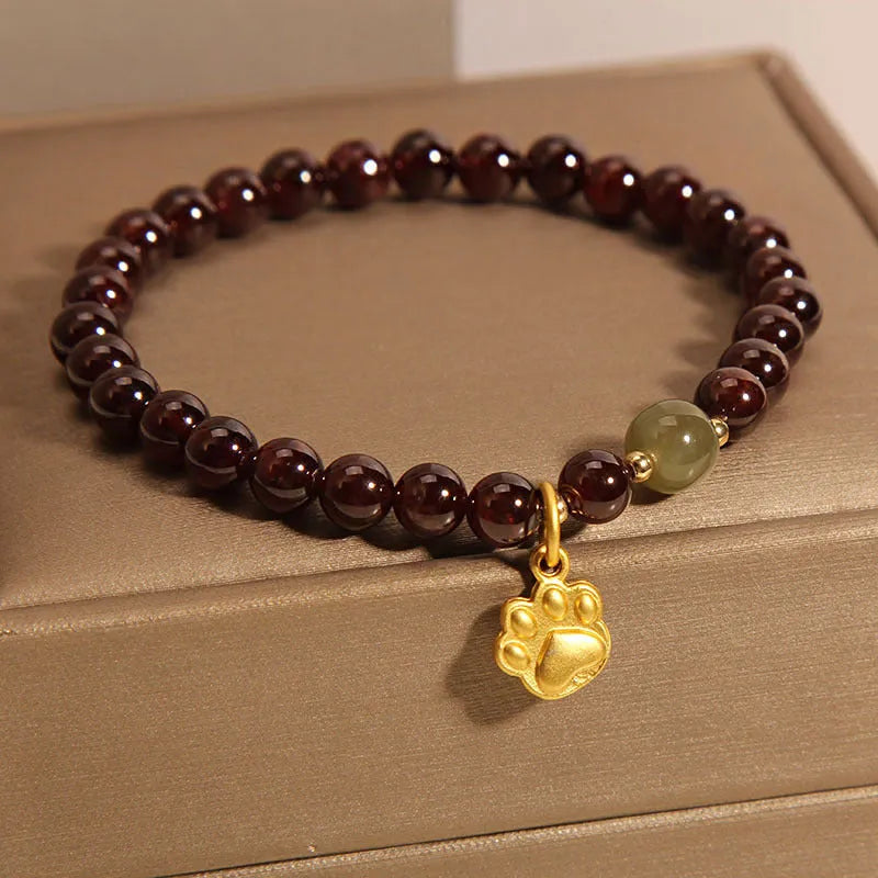 Women's Cat's Paw garnet style crystal bracelet on packaging