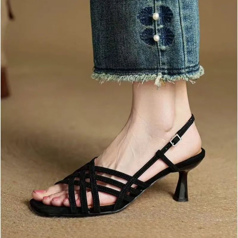 Retro light brown women's high heel sandals with thin cross straps and an ankle buckle on a square toe.