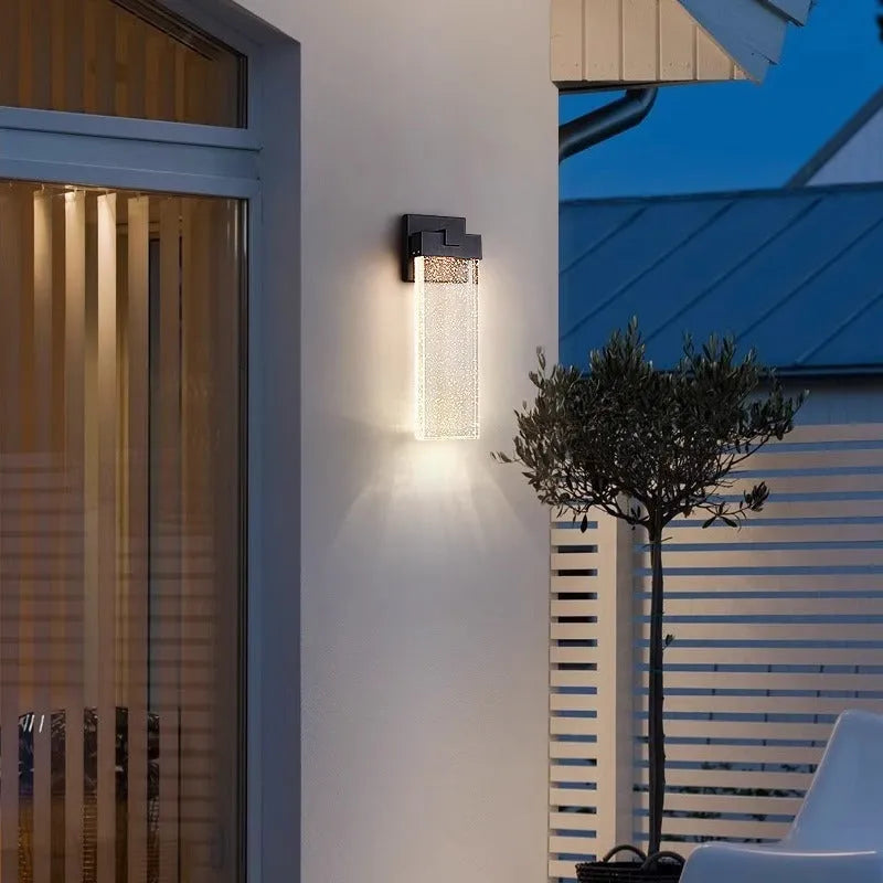 Black outdoor LED wall light with stainless steel shell, shown in large and small size options.