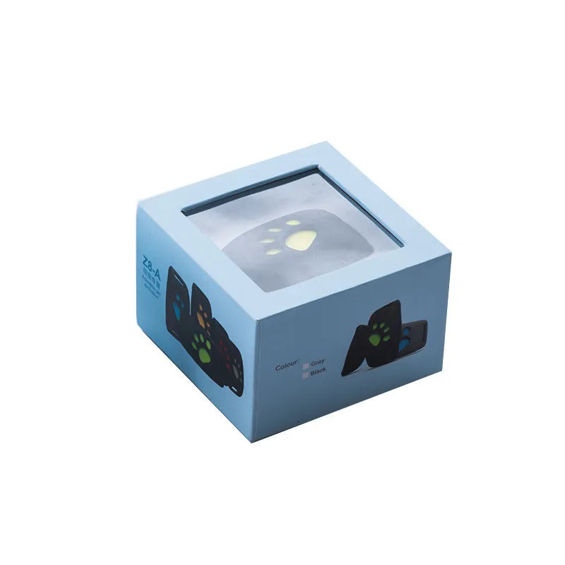 Waterproof GPS pet tracker device in black with yellow interior showing compact 65.5mm design