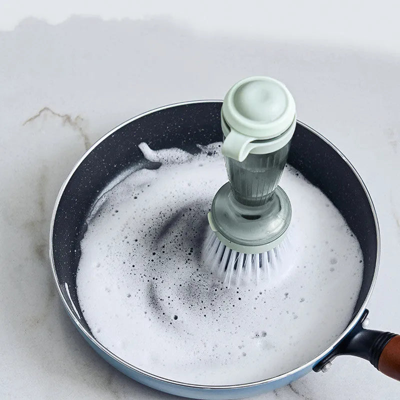 Pot and dish brush with integrated soap dispenser and replaceable brush head in mint green