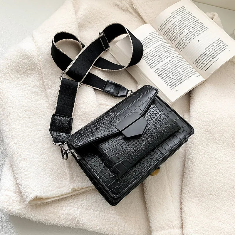 Vintage-style black PU crossbody bag with adjustable strap showing interior