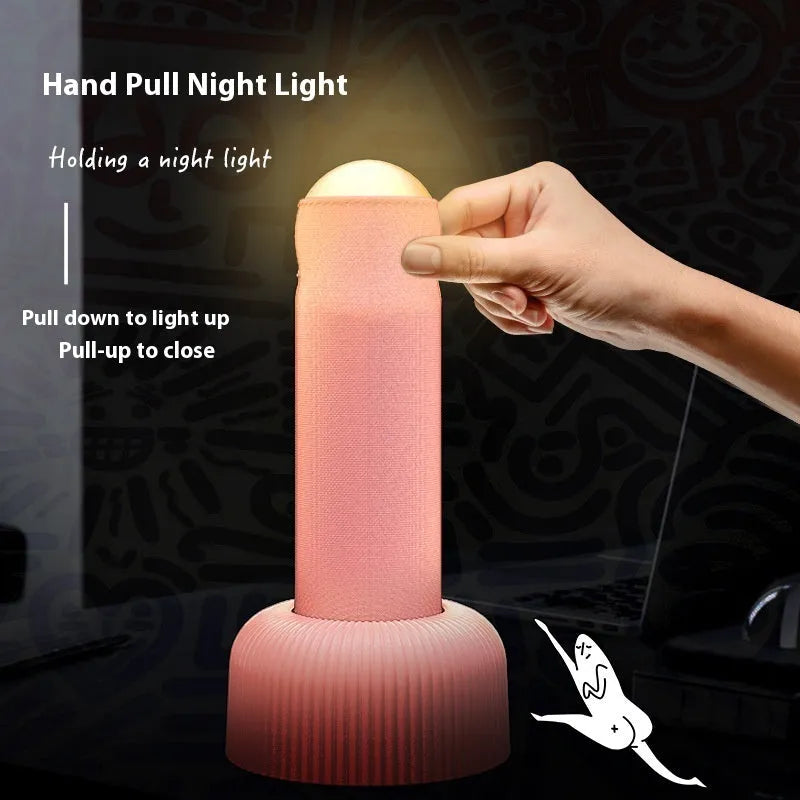 Handheld LED night light with fabric cover and base, warm light, black or pink, 92 x 193mm