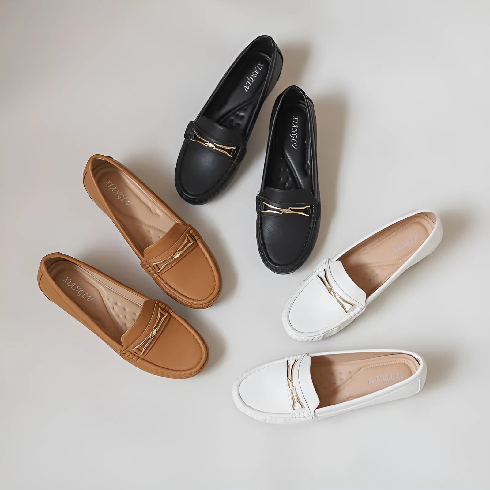 Black height-increasing casual slip-on shoes with a round toe and rubber sole.
