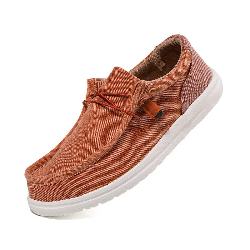 Men's green and orange canvas casual shoes with mosaic design and rubber sole.