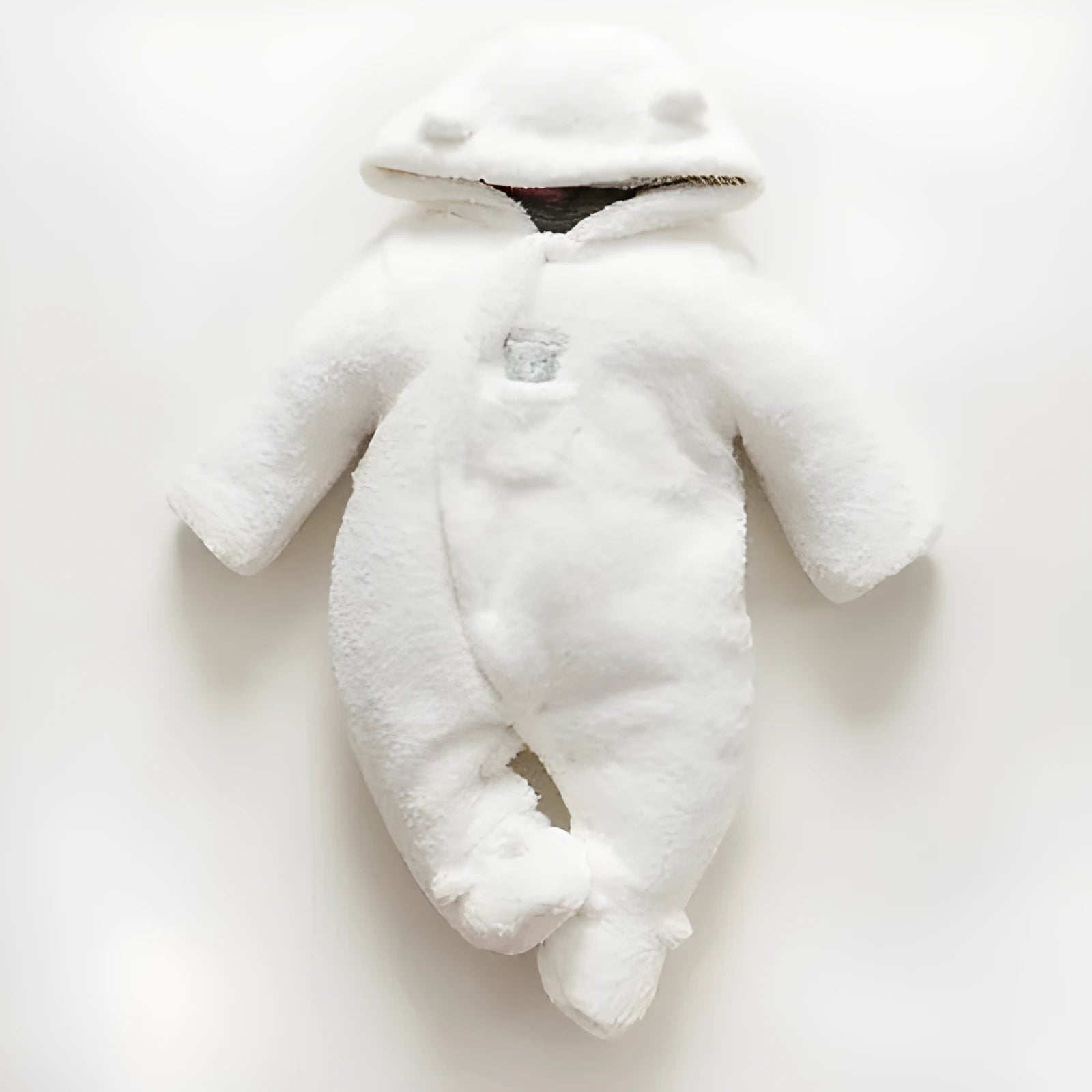 Brown cotton baby winter jumpsuit with covered feet and a front zipper.