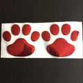 PVC dog footprint car sticker showing hand-shaped brush design on vehicle bumper