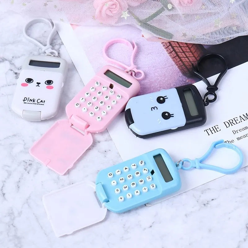 Creative cookie-shaped cute mini calculator with key ring in pink, blue, grey, and black colours