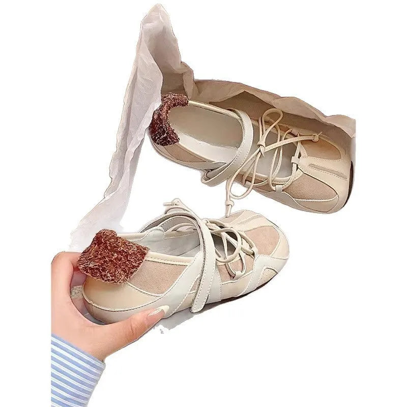 Women's Mary Jane style ballet shoes with round toe and front lace-up closure in artificial leather