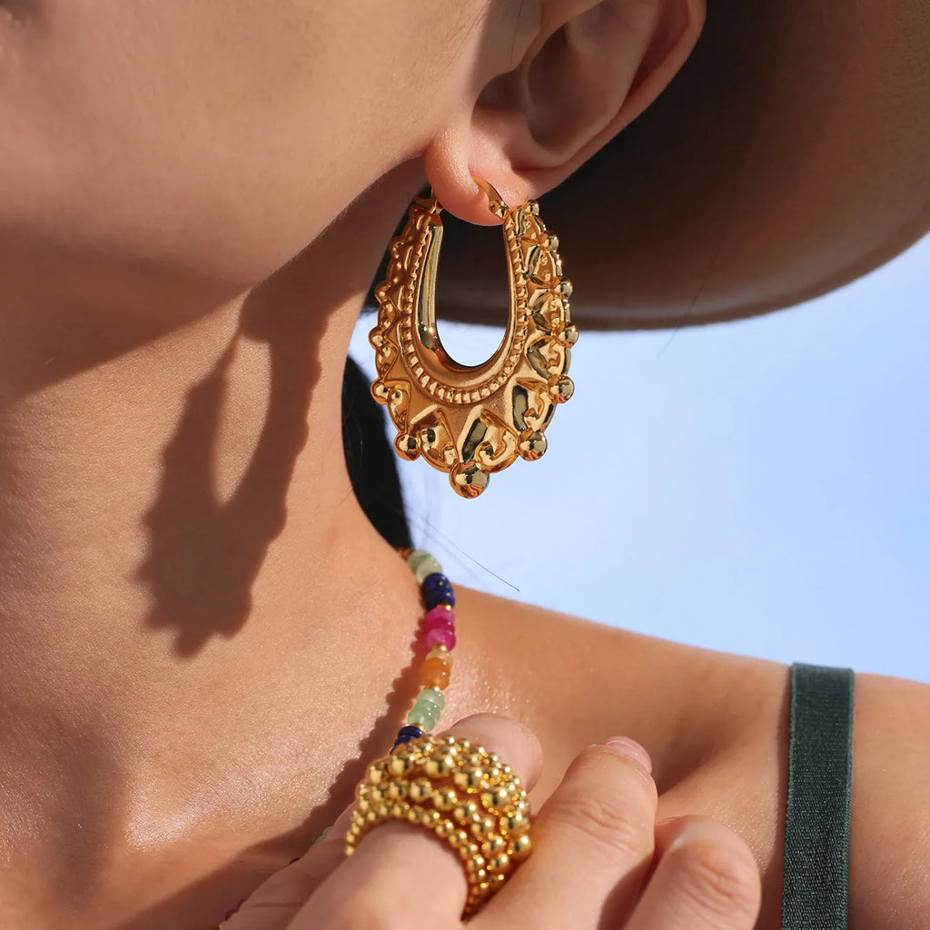 Stainless steel geometric hollow earrings in gold electroplated round shape for women fashion OL style