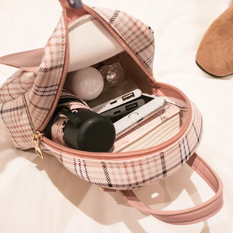 A diagonal one shoulder phone bag made from PU leather in a choice of five colours.