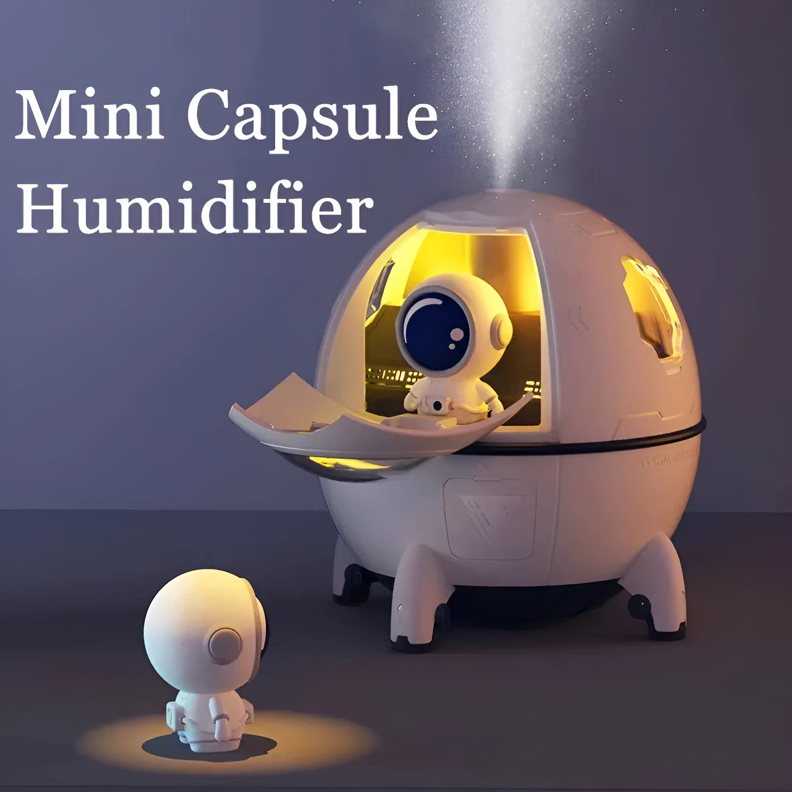 Purple astronaut space capsule USB humidifier with colourful LED lights on desktop