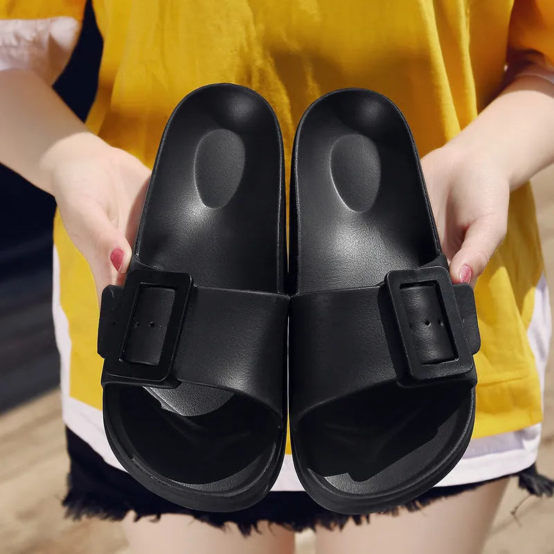 Grey blue women's flip-flop slippers with a single buckle on a soft EVA sole.