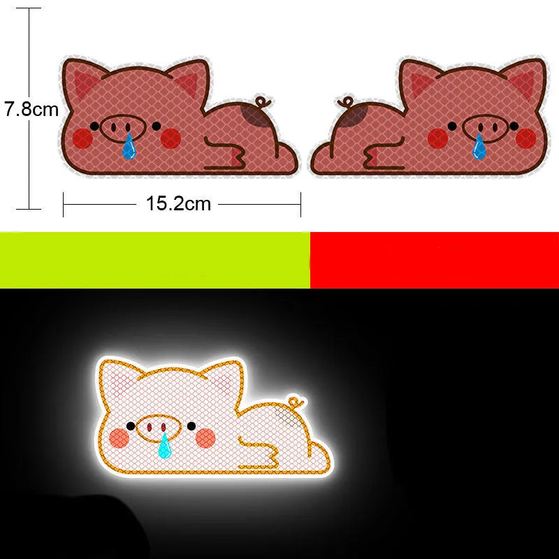 A pair of diamond-grade reflective safety stickers for vehicles, showing sample designs like a smiling cat or tiger.