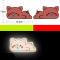 A pair of diamond-grade reflective safety stickers for vehicles, showing sample designs like a smiling cat or tiger.