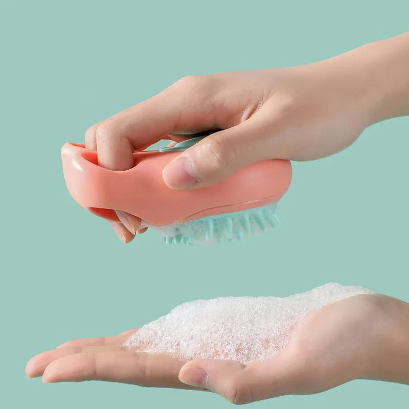 Claw-shaped silicone bath brush for dogs and cats in blue, pink, white, or yellow.