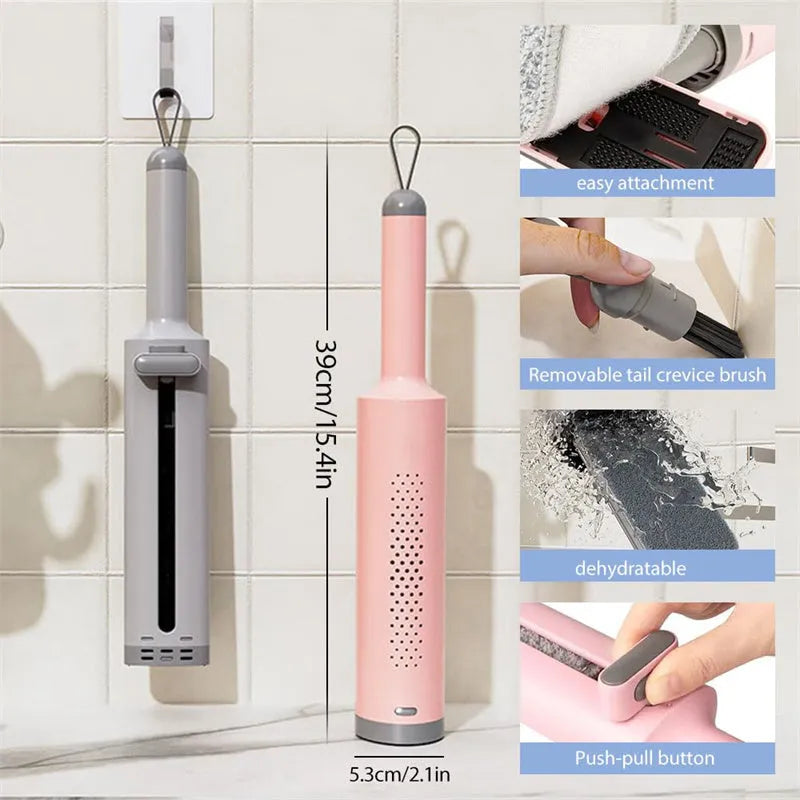Pink rotatable self-squeeze mini flat mop with microfiber pad, shown extended to its full length.