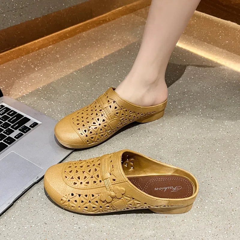Women's apricot PVC half slippers with flat toe box and hollow out fairy style design.