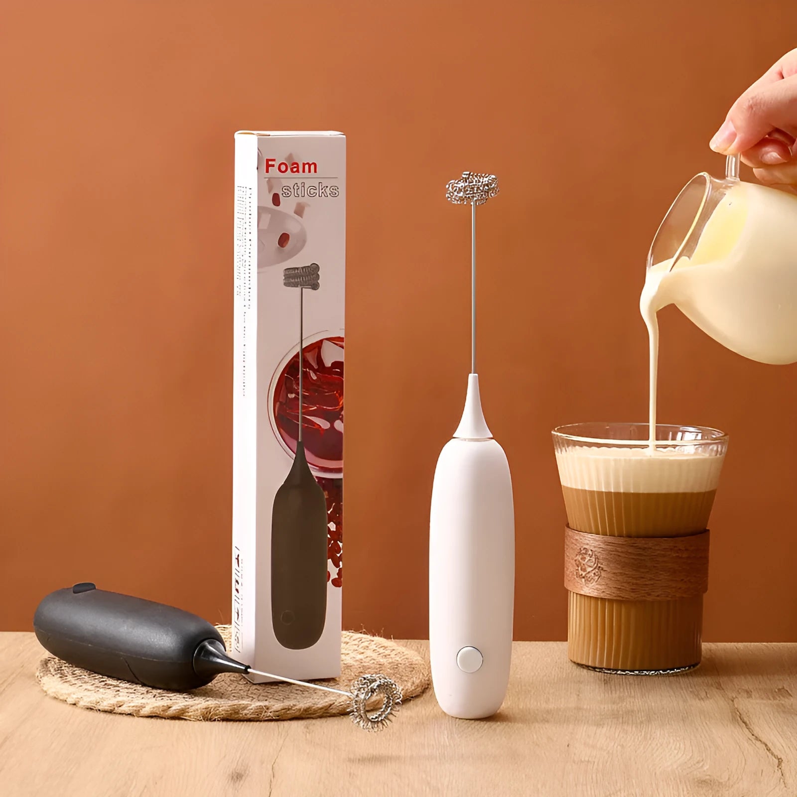 Hand-held electric milk frother blender in black colour with modern simplicity design