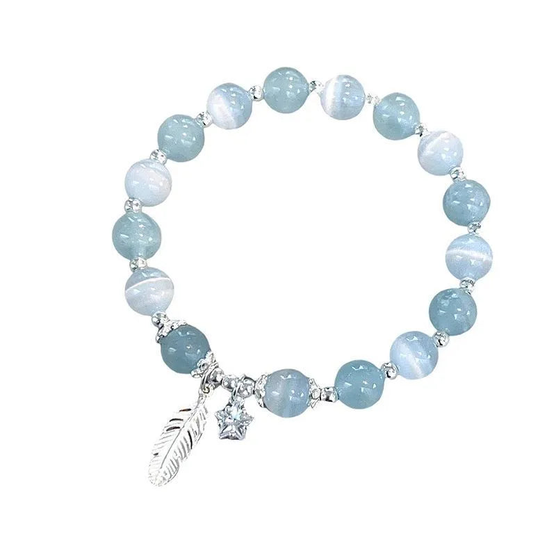 Glass crystal bead bracelet with blue moonlight colour and eight star design elements