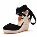 Women's bohemian wedge sandals with beaded details and a buckle strap.