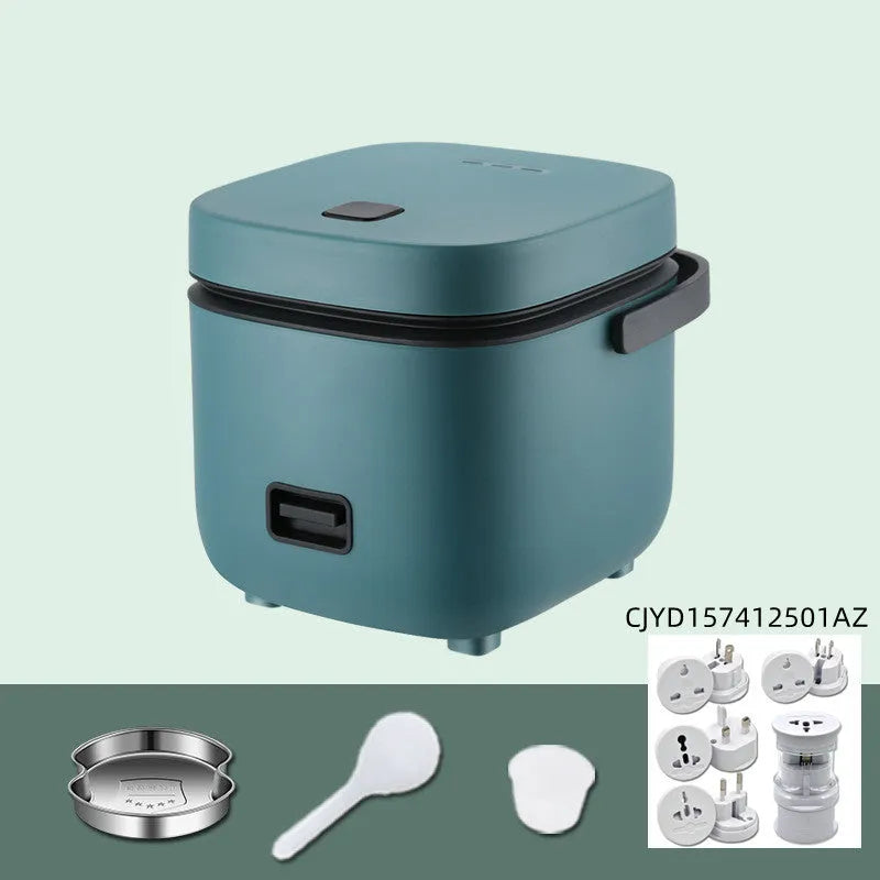 Green 1.2L mini rice cooker with metal body, button controls, and steaming plate on a worktop.