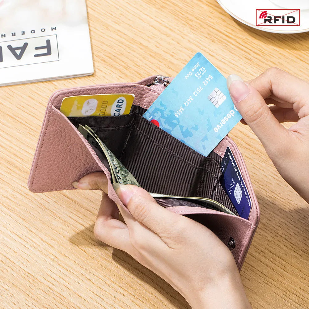 Women's leather tri-fold mini RFID wallet in elephant gray, 10x4x7.5cm, with sewing thread detailing